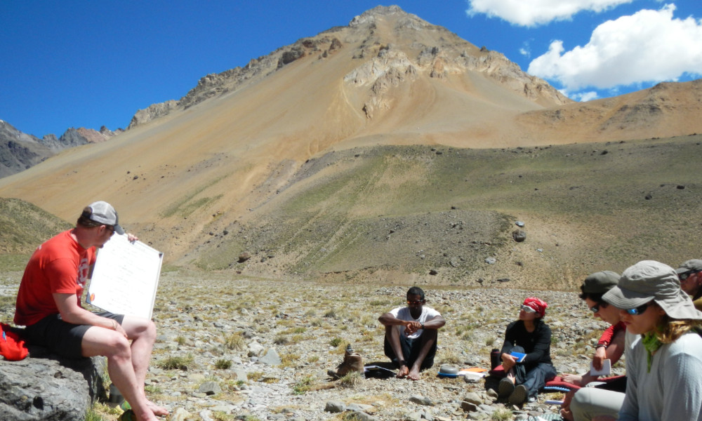 Students learning risk management techniques during an acclimatization day at base camp